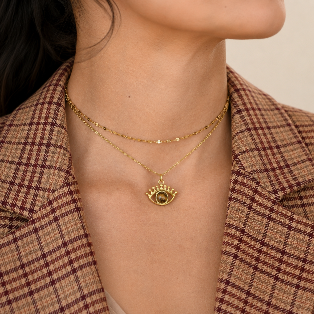 Gold-tone stainless steel double-layer choker necklace with evil eye charm and natural tiger's eye stone