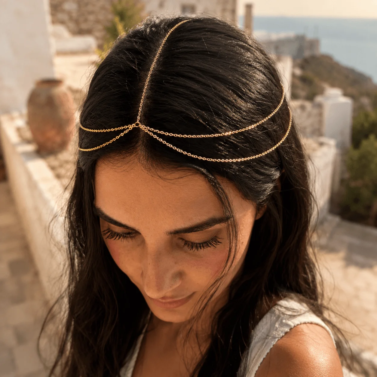 Delicate gold-tone stainless steel bridal forehead chain draped across hairline for wedding day elegance